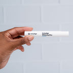 Person holding Invisalign whitening pen
